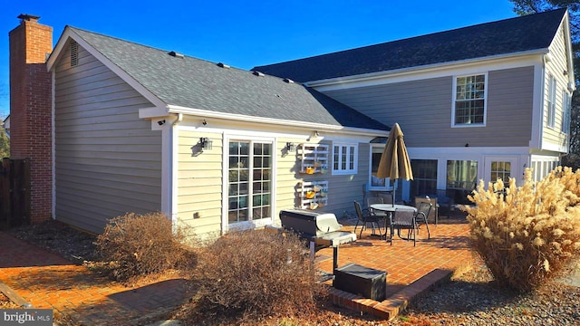 back of property with a patio area