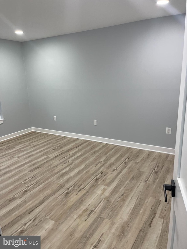 spare room featuring light hardwood / wood-style flooring