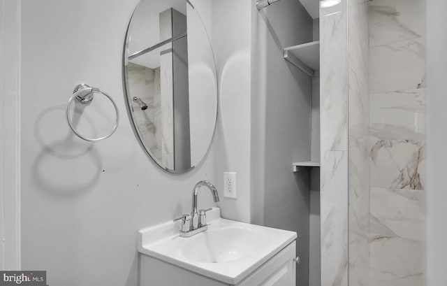 bathroom featuring vanity and a tile shower