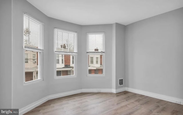 empty room featuring light hardwood / wood-style floors