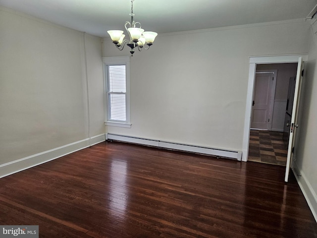 spare room featuring ornamental molding, dark wood-type flooring, a baseboard radiator, and a chandelier