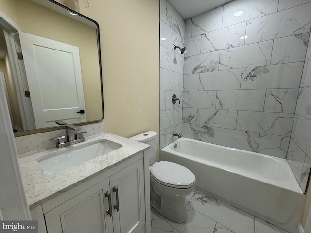 full bathroom with toilet, tiled shower / bath combo, and vanity