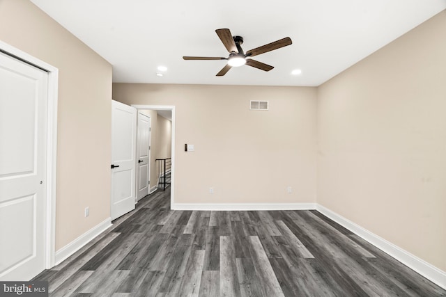 unfurnished bedroom featuring ceiling fan, a closet, and dark hardwood / wood-style floors