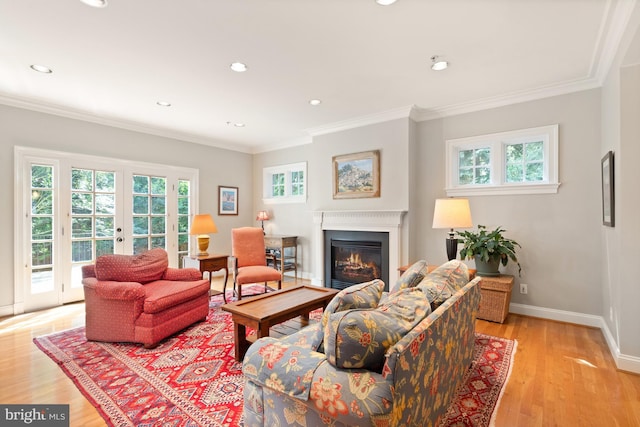 living room with light hardwood / wood-style floors and ornamental molding