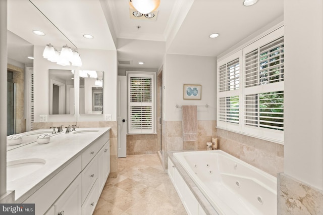 bathroom featuring crown molding, vanity, independent shower and bath, and tile walls