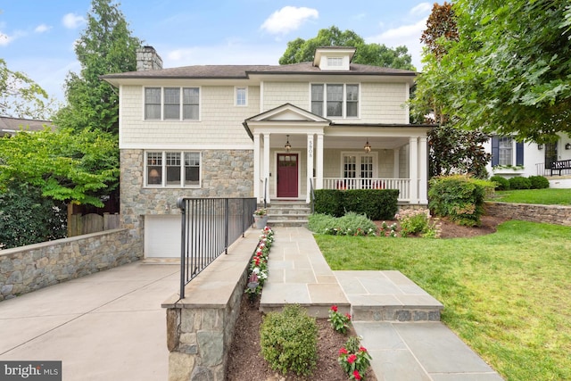 view of front of property with a front lawn and a garage