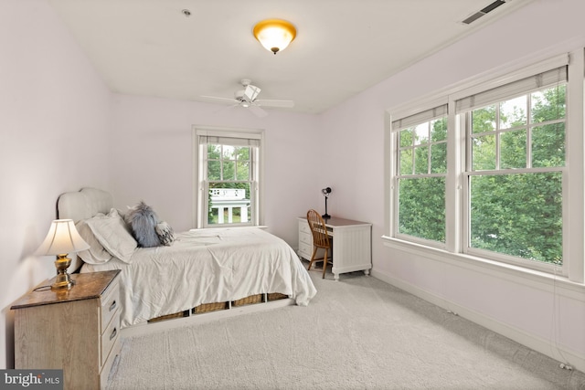 bedroom with ceiling fan and carpet floors