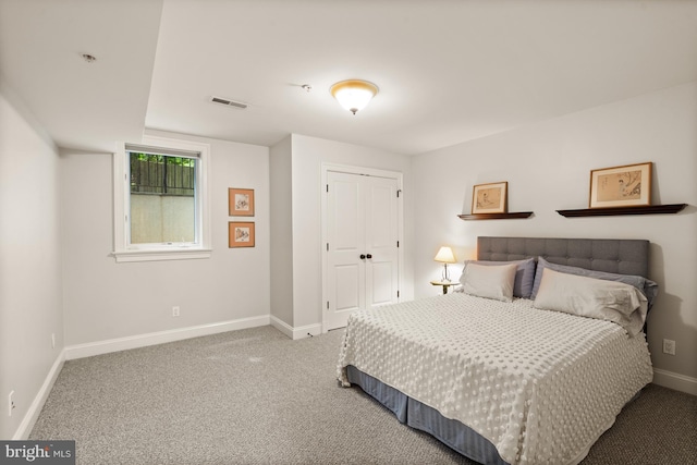 bedroom with a closet and carpet floors