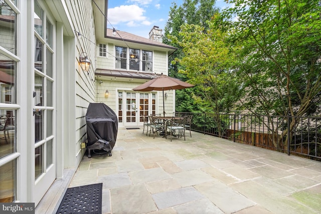 view of patio with a grill and french doors