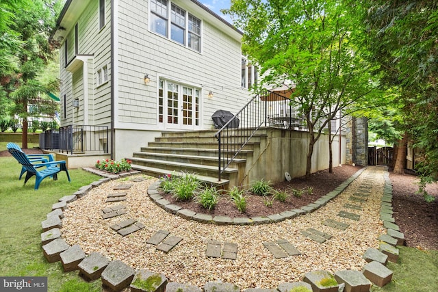 back of house featuring a wooden deck