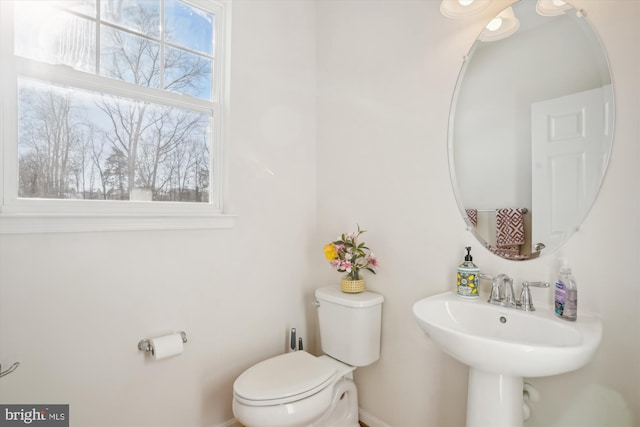 bathroom featuring toilet and sink