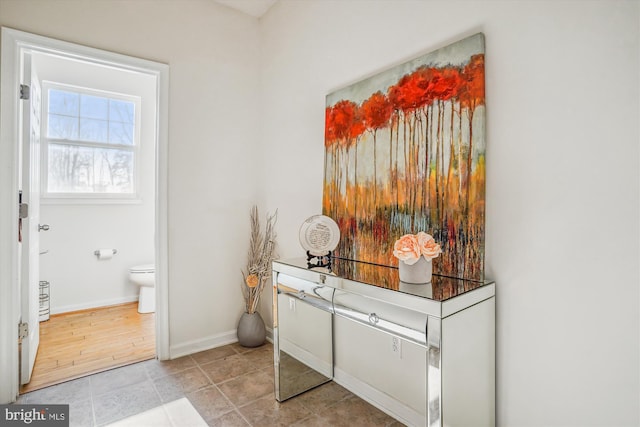 bathroom with tile patterned flooring and toilet