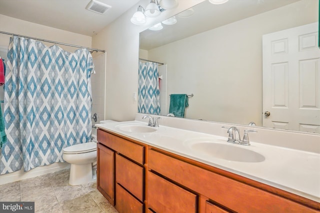 bathroom featuring toilet, walk in shower, and vanity