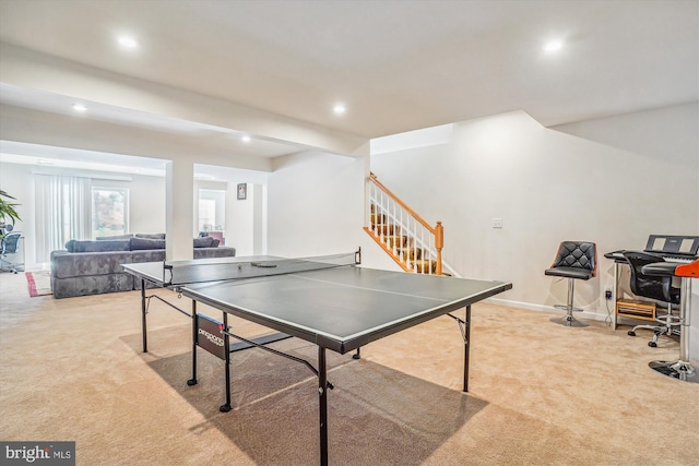 recreation room featuring light colored carpet