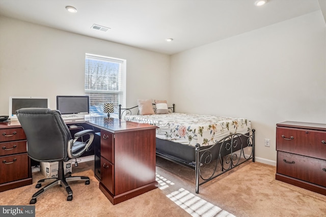 bedroom with light colored carpet