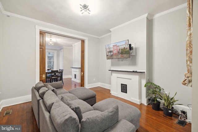 living room featuring wood-type flooring and ornamental molding