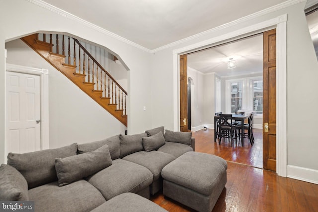 living room with crown molding and dark hardwood / wood-style flooring