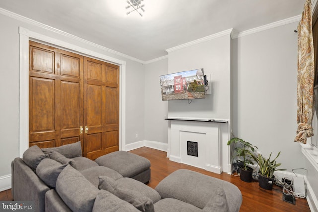 living room featuring dark hardwood / wood-style floors and ornamental molding