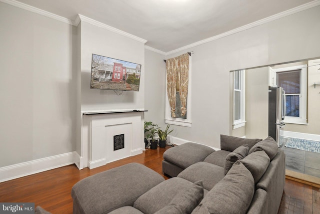 living room with dark hardwood / wood-style flooring and ornamental molding