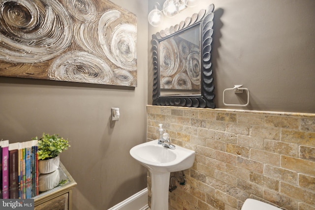 bathroom with tasteful backsplash