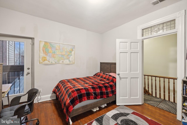 bedroom featuring dark wood-type flooring