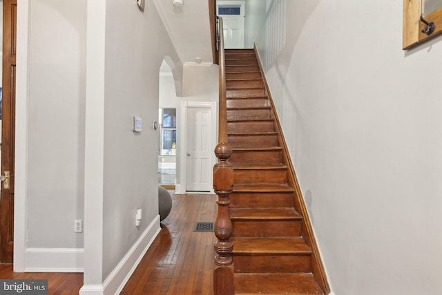 stairway featuring hardwood / wood-style flooring