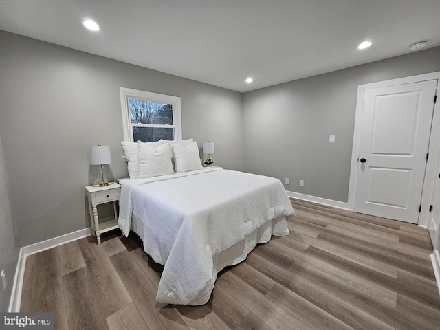 bedroom with hardwood / wood-style floors