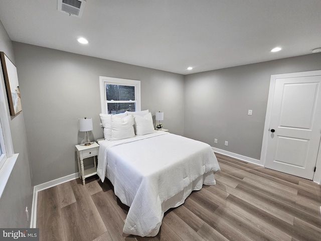 bedroom featuring hardwood / wood-style floors