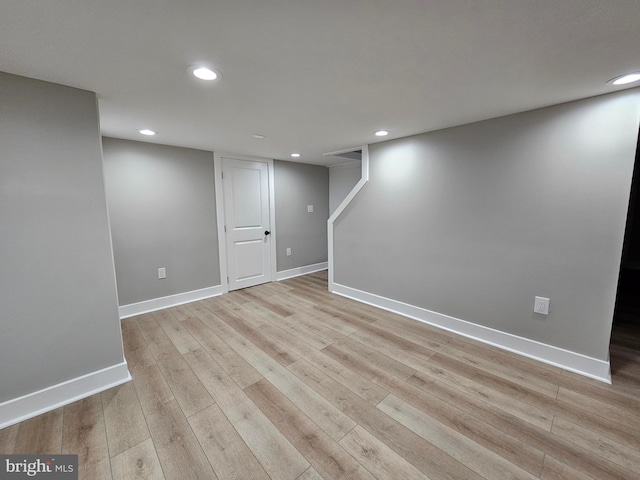 basement featuring light hardwood / wood-style flooring