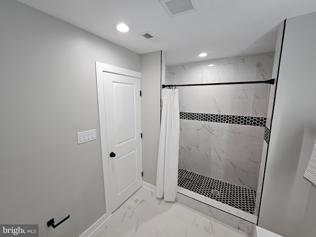 bathroom featuring walk in shower