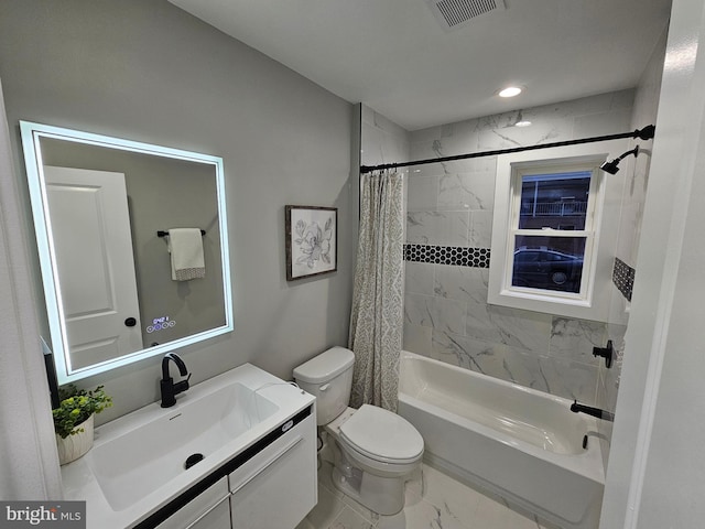 full bathroom featuring shower / tub combo, vanity, and toilet