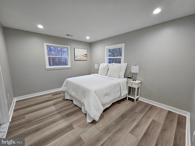 bedroom with hardwood / wood-style flooring