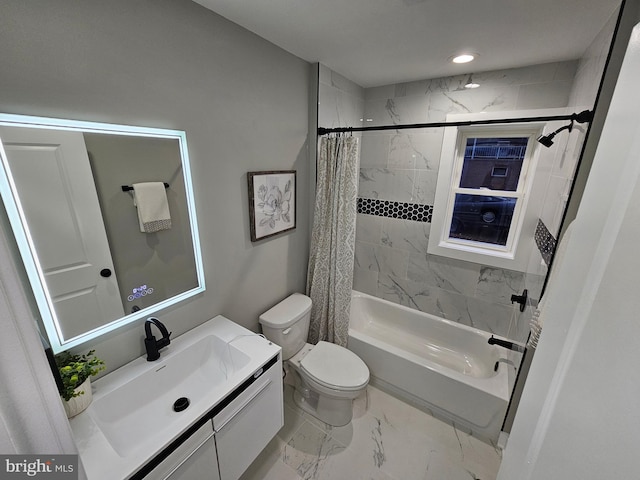 full bathroom with vanity, shower / bath combo, and toilet