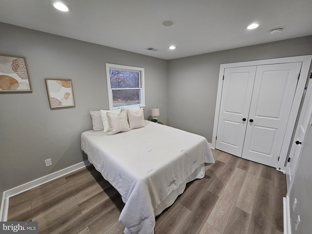 bedroom featuring a closet and hardwood / wood-style floors