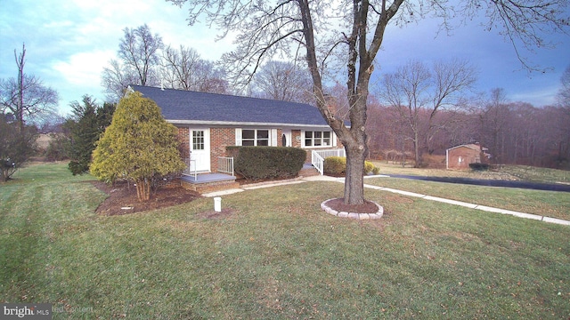 single story home featuring a front yard