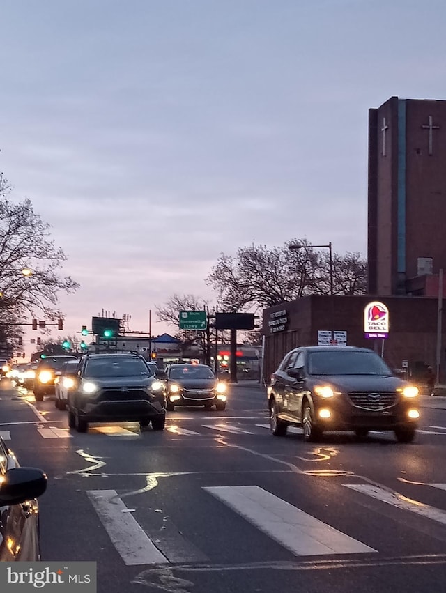 view of parking at dusk