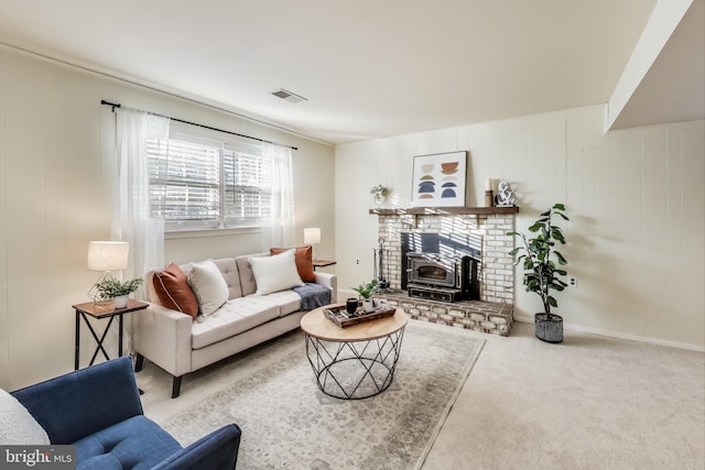 living room with carpet floors and a wood stove