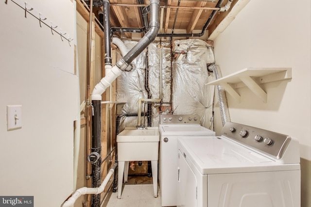 washroom featuring washer and clothes dryer