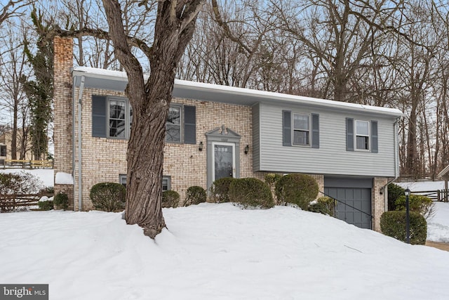 split foyer home featuring a garage