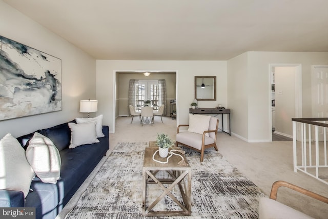 carpeted living room with french doors