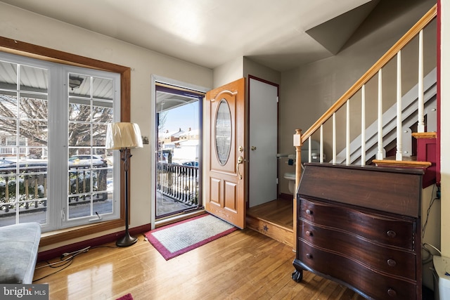 entryway with hardwood / wood-style flooring