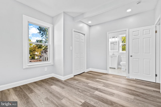 entryway with light hardwood / wood-style floors and plenty of natural light