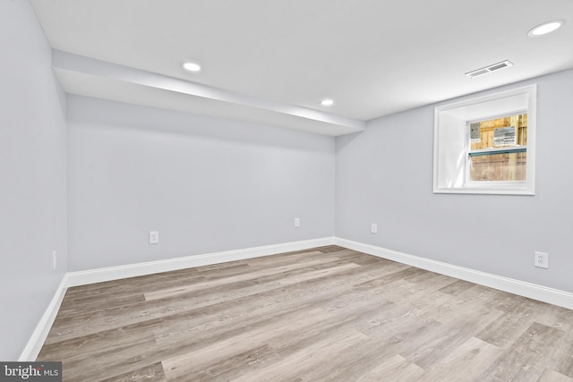 basement featuring light hardwood / wood-style floors