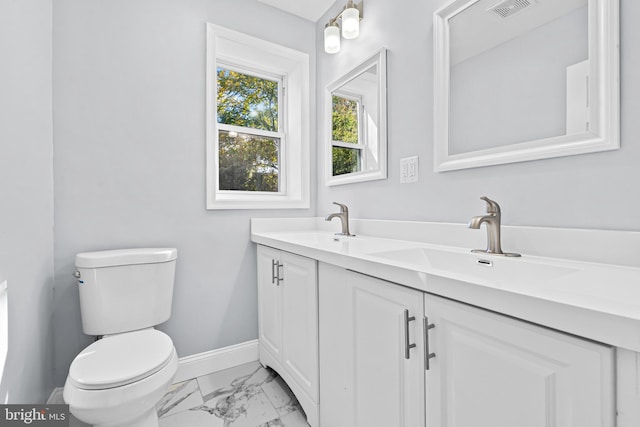 bathroom with vanity and toilet