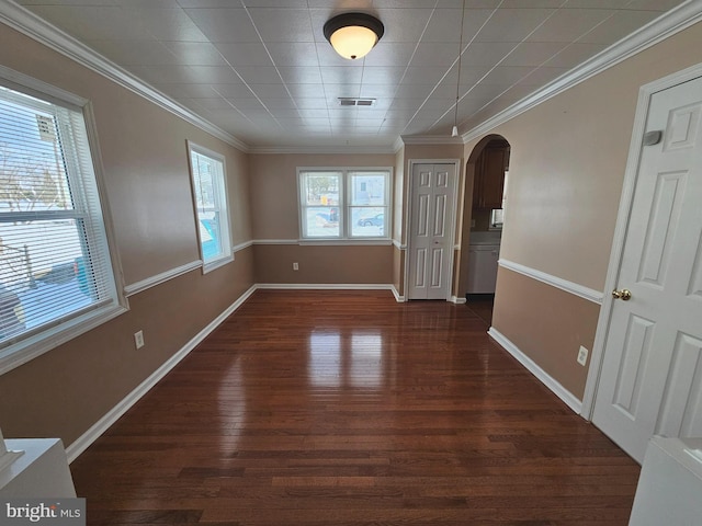 unfurnished room with dark hardwood / wood-style flooring and ornamental molding