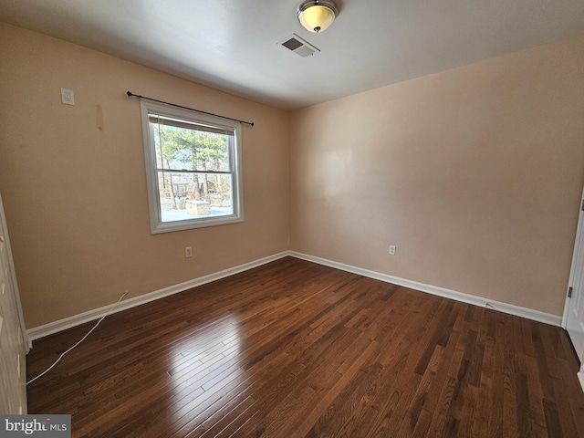 unfurnished room featuring dark hardwood / wood-style flooring