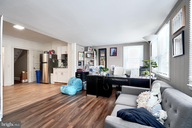 home office with hardwood / wood-style flooring