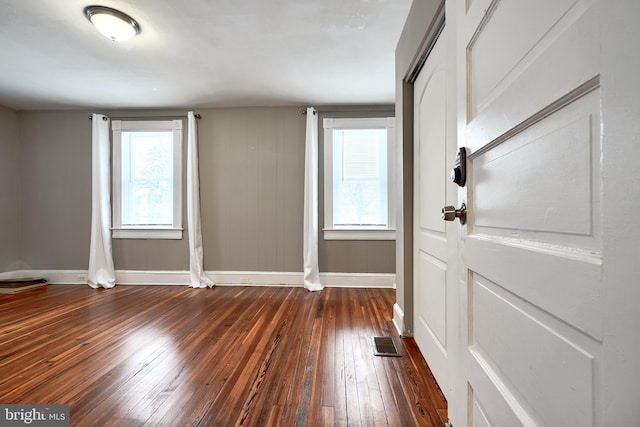 interior space with dark hardwood / wood-style floors