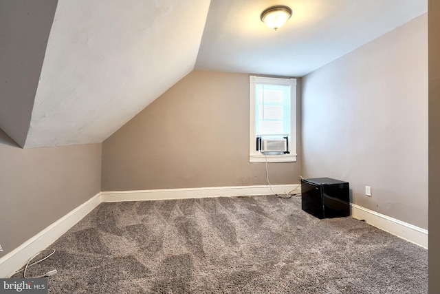 additional living space with carpet flooring, cooling unit, and vaulted ceiling