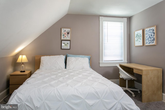 carpeted bedroom featuring vaulted ceiling